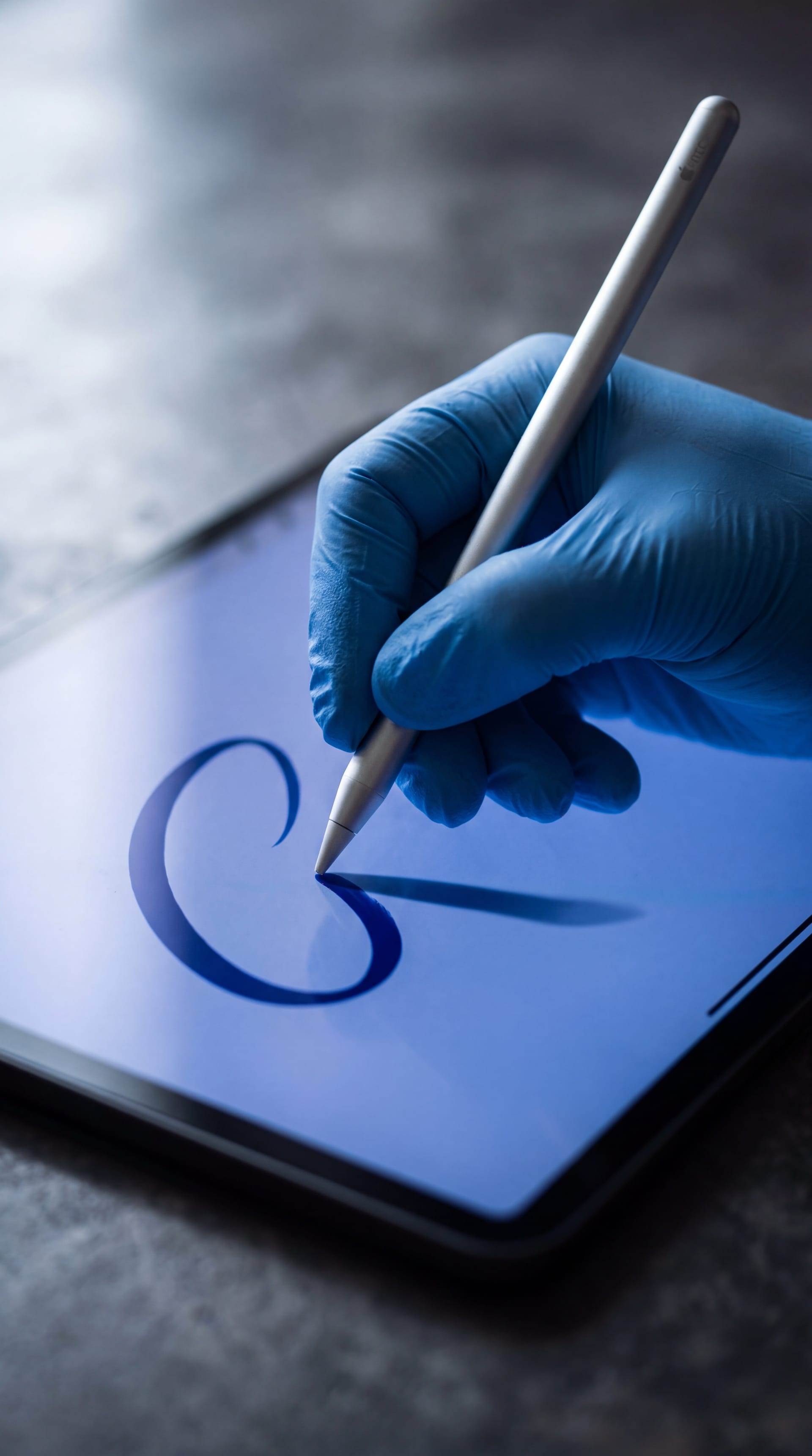 Gloved hand drawing the final ink mark on a Memorandum of Agreement